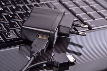 Device for charging via USB and laptop,close-up