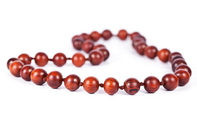 Necklace with wooden beads isolated on white background