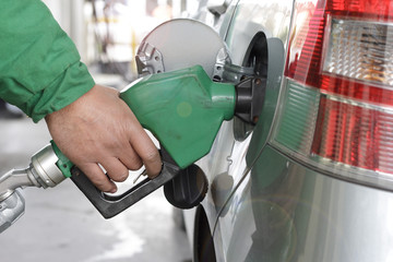 Refueling Automobile With Gasoline Pump Nozzle