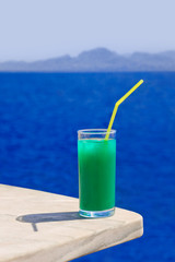 Cocktail on marble table at beach