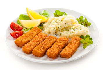 Fried fish fingers, mashed potatoes and vegetables