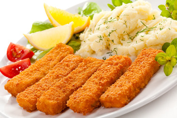 Fried fish fingers, mashed potatoes and vegetables