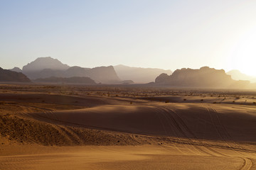 SUNSET IN THE WADI RUM DESERT IN JORDAN.