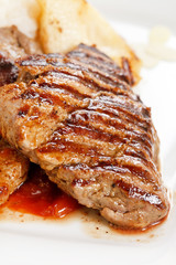 Grilled pork steak with pear