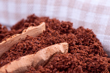 Ground coffee and wooden spoon