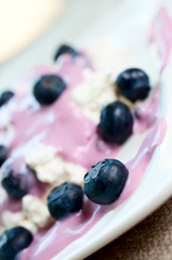 Ripe blueberries in yogurt and cottage cheese