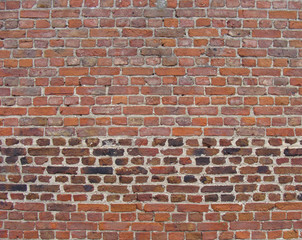 Obraz premium orange pink bright colored aged brick wall