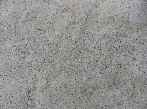 speckled wavy gray beige marble surface