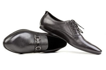 Two black men shoes against white background