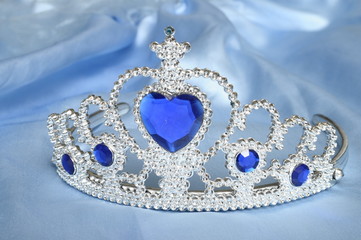 Toy tiara with diamonds and blue gem, like a princess crown