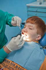 Kid at dentist inspection