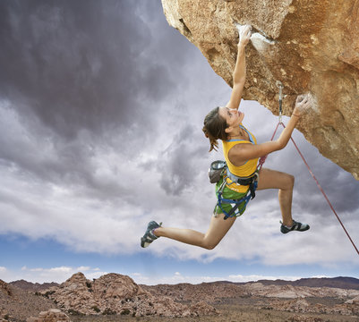 Rock climber dangling.