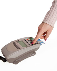 consumerism hand holding plastic card in payment machine