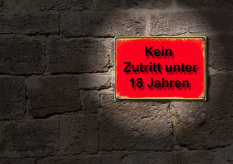 Schild im Rotlicht - Kein Zutritt unter 18 Jahren