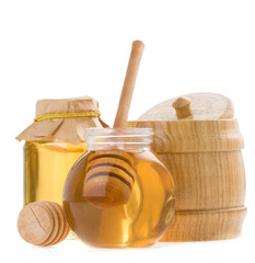 glass pot of honey and stick