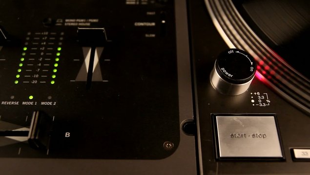 Spinning record and dj mixer