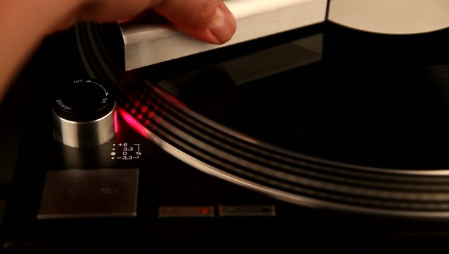 Cleaning record on spinning turntable