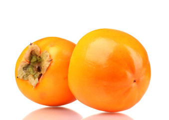 Two appetizing persimmons isolated on white