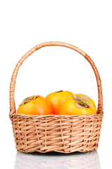 Appetizing persimmons in pad isolated on white
