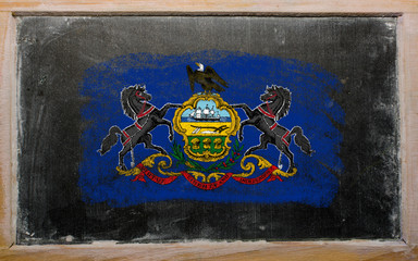 flag of US state of pennsylvania on blackboard painted with chal