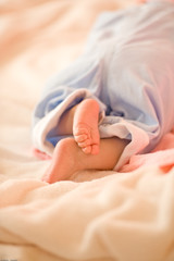 Little foot of sleeping newborn infant