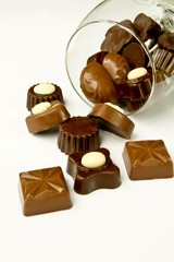Closeup of valentine chocolates in overturned glass