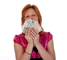 Portrait of pretty young woman with money, isolated on white bac