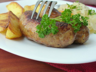 Grilled sausages with potato and cabbage