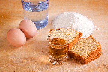 Slices of Cake with Raw Ingredients and Dessert Wine Glass