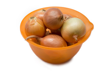 onion in an orange bowl on white background