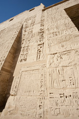 Egyptian hieroglyphic carvings on a temple wall