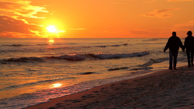 Couple Walking At Sunset