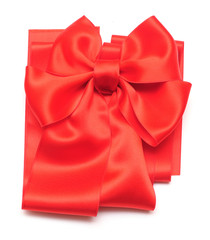 Red ribbon with bow on white