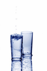 Two glasses with drops of water