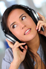 Beautiful young woman listening to music