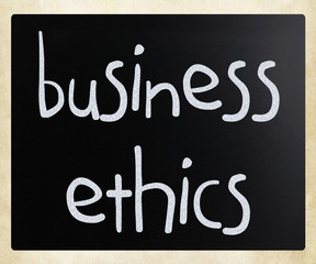 "Business Ethics" handwritten with white chalk on a blackboard