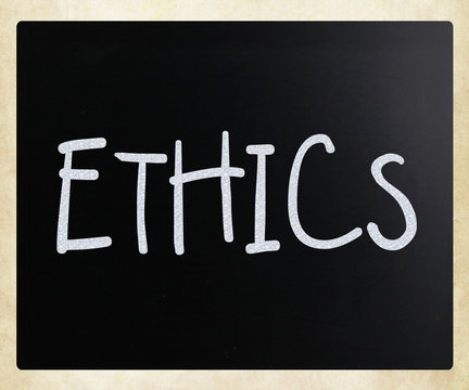 "Ethics" handwritten with white chalk on a blackboard