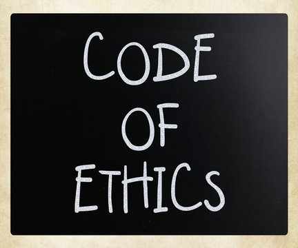 "Code of ethics" handwritten with white chalk on a blackboard