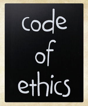 "Code of ethics" handwritten with white chalk on a blackboard