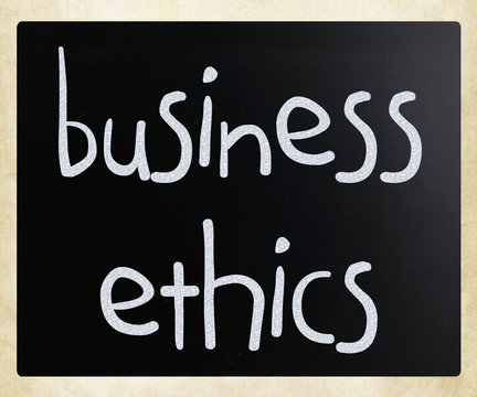 "Business Ethics" handwritten with white chalk on a blackboard