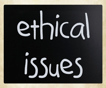 "Ethical issues" handwritten with white chalk on a blackboard