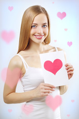 smiling girl with valentine card