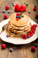 Pancakes on wooden table