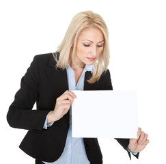 Cheerful businesswoman presenting empty board