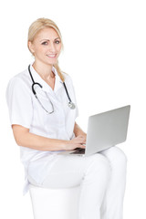 Medical doctor working on laptop