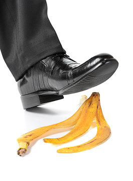 Businessman Foot About To Slip And Fall On A Banana Skin