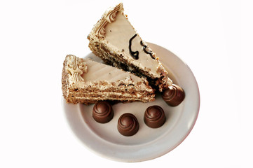 delicious slices of cake and candies on a plate