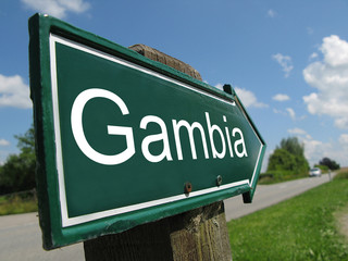 Gambia signpost along a rural road - obrazy, fototapety, plakaty