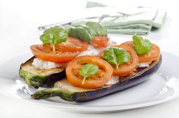 grilled eggplant with rice and tomato slices