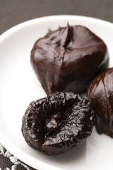 Dried plums in chocolate